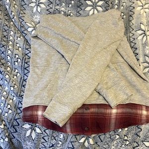 Long sleeved light gray hooded shirt with flannel design